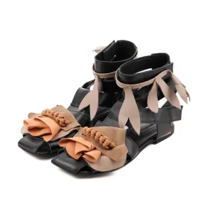 Light is my Accomplice black leather and beige suede sandals